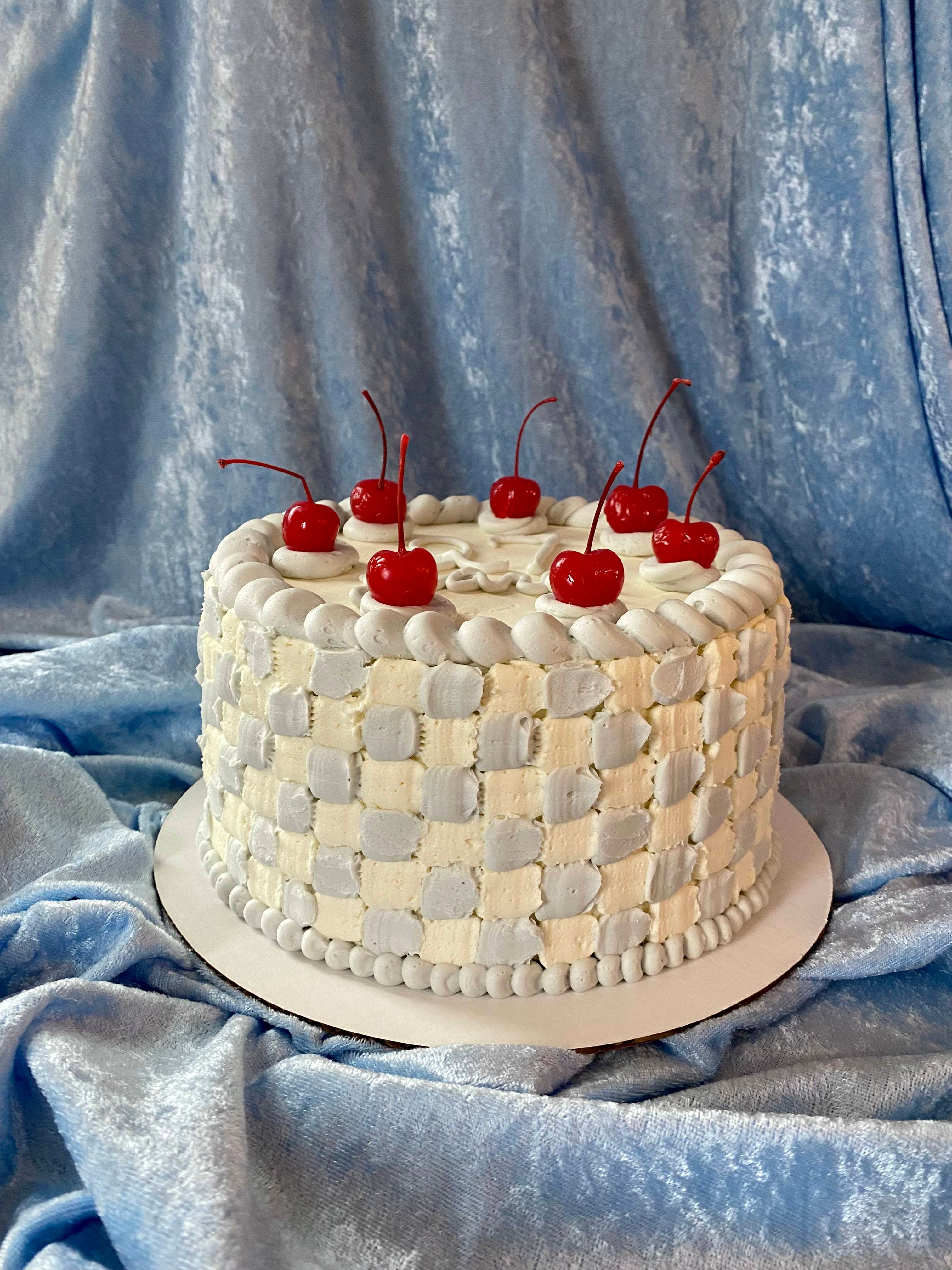 photo of a round pastel checkerboard cake