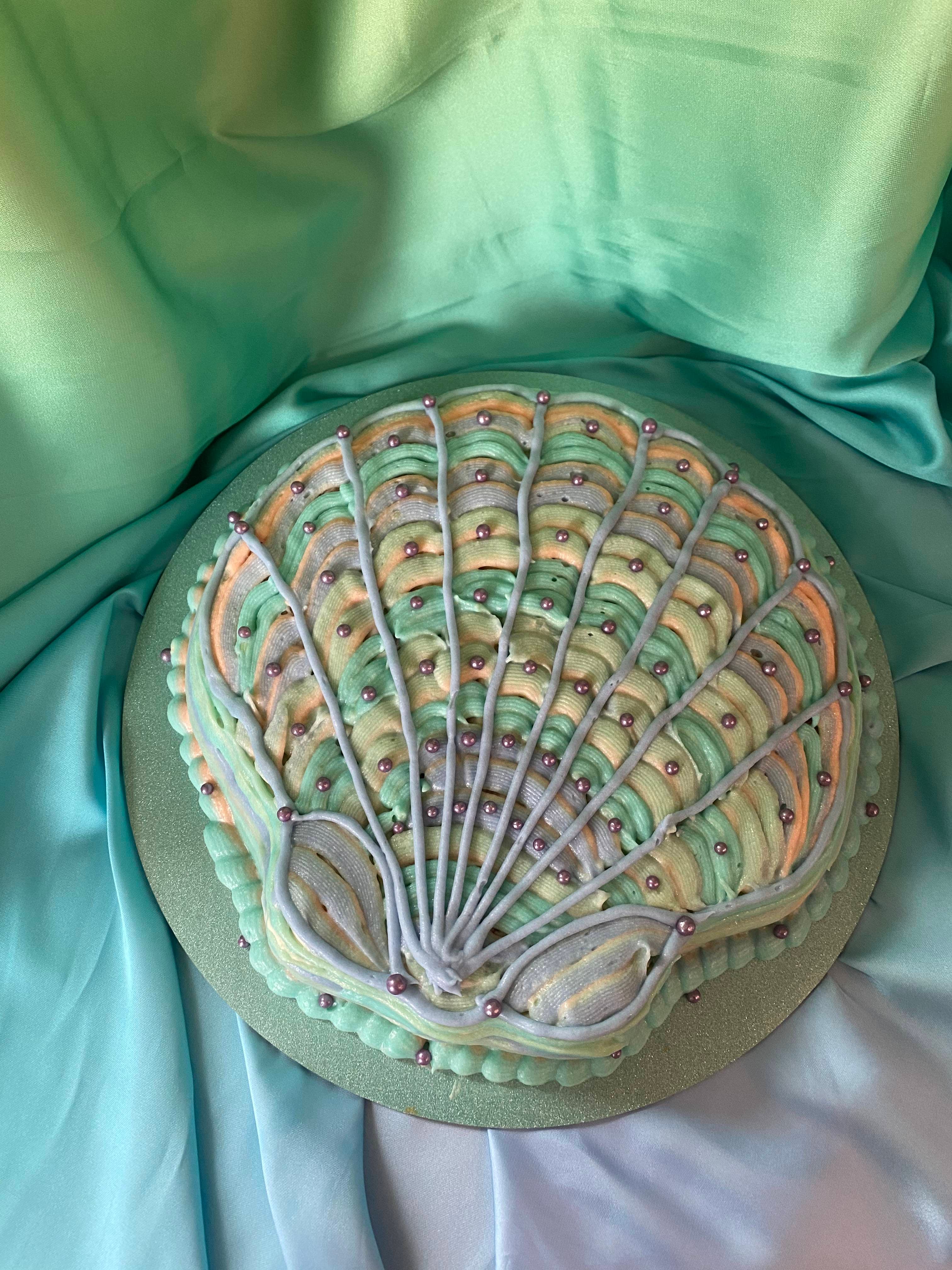 photo of a cake shaped like a seashell